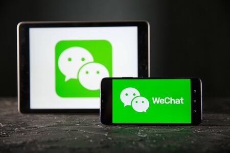 Tula 24 09 2019: WeChat on the tablet and phone display.のeditorial素材