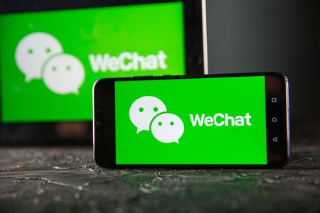 Tula 24 09 2019: WeChat on the tablet and phone display.のeditorial素材