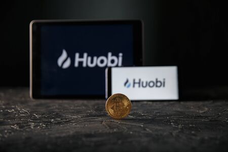 Tula 24 09 2019: Huobi on the tablet and phone display.のeditorial素材