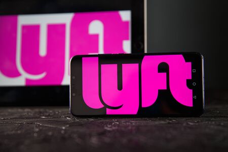 Tula 24 09 2019: lyft on the tablet and phone display.のeditorial素材