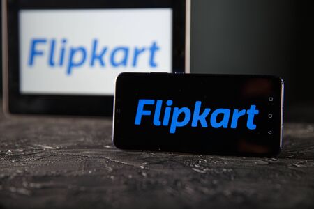Tula 24 09 2019: Flipkart on the tablet and phone display.のeditorial素材