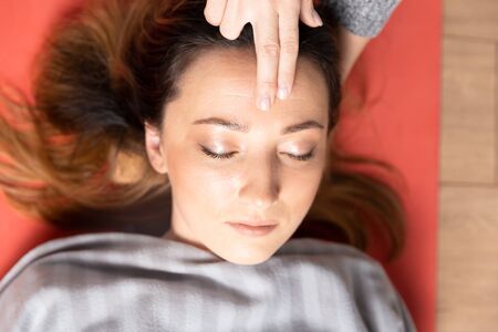 Thetahealing concept. Meditation in process. Two women having calm down their mind.の写真素材