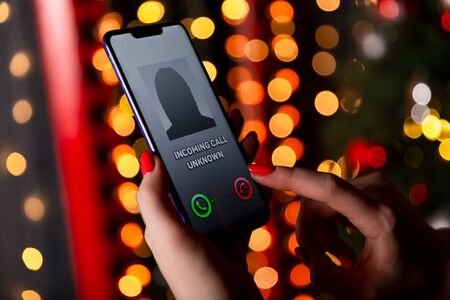 Phone call from unknown number. Scam, fraud or phishing with smartphone concept. Prank caller,...