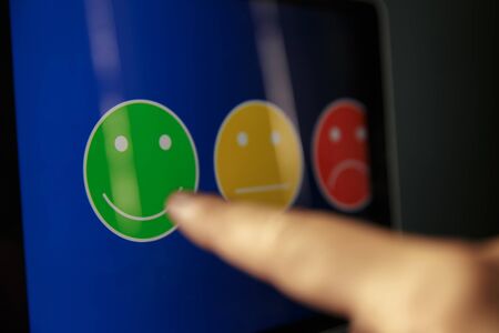 Tablet reviews concept. Different smilings on the gadget