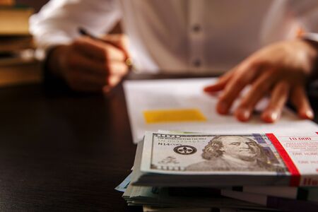 Closeup view of money and laywer concept on the desk. Male attorney behindの写真素材