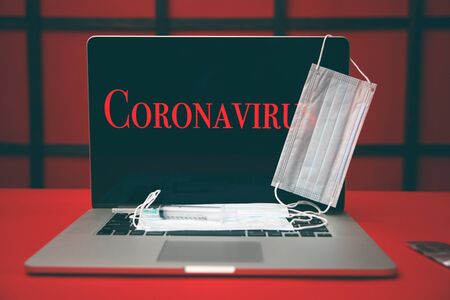 Corona virus on the laptop screen.の写真素材