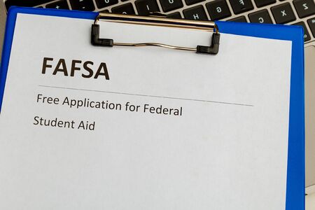 Fafsa. Student aid application form on the tablet