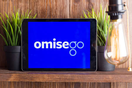 Tula Russia 16.01.20 omisego on the tablet computer screen isolated.