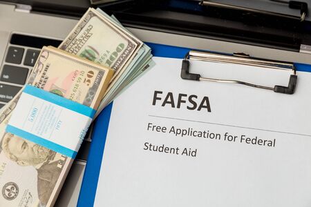 Fafsa. Student aid. Money on the table.の写真素材