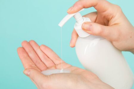 Hygiene concept. Closeup picture of womans hands in a soap and sanitiser.の写真素材