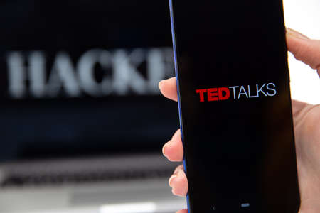 Tula Russia 12.02.2020 Hucked inscription on the laptop and TedTalks on the phone screen.のeditorial素材
