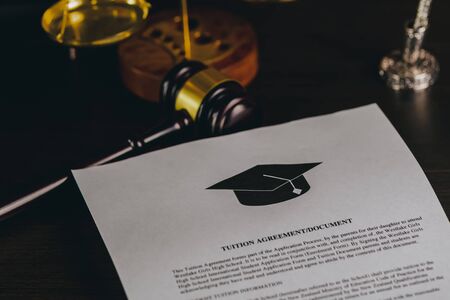 Man reading college or university application or document from school. College acceptance letter or student loan paper. Applicant filling form or planning studiesの写真素材