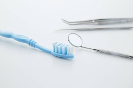 Basic dentist tools isolated on white background. Dental health and teethcare concept