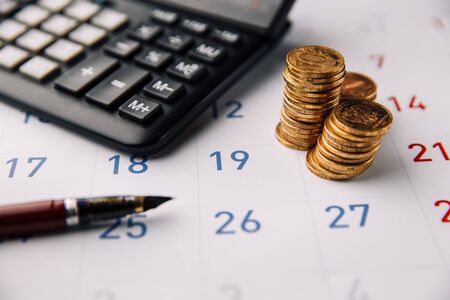 Business, finance and loan concept. Monthly saving and planning money for expenseの写真素材
