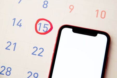Red highlighter with ovulation day mark on calendar, Concept of fertility chart, trying to have baby and natural contraceptionの写真素材