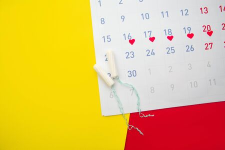 Menstruation calendar with cotton tampons.Woman critical days, woman hygiene protection conceptの写真素材