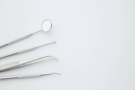 Basic dentist tools isolated on white background. Dental health and teethcare conceptの写真素材