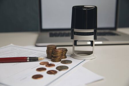 Saving money concept,graph, stacks of coins ,chart and pen ,copy space.selective focus,vintage color