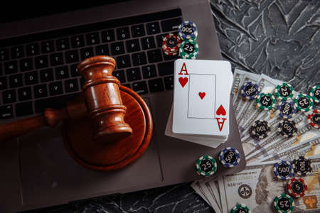 Judges gavel, poker chips and playing cards. Concept of Law and regulation of gamblingの写真素材