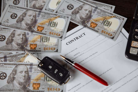 Contract form for purchase car with pen and money. Savings conceptの写真素材