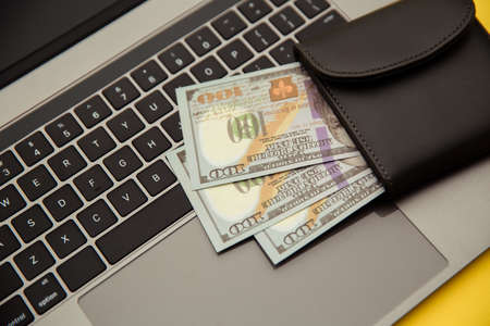 Wallet with money on keyboard. Online shoppingの写真素材