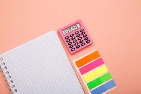 Back to school concept - school office supplies on pink background