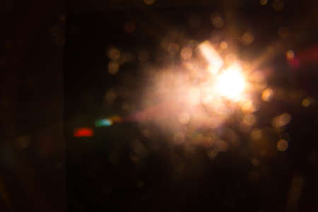 Abstract Natural Sun flare on the black backgroundの写真素材