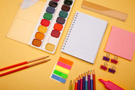 Back to school concept - school office supplies on orange backgroundの写真素材