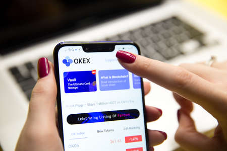 Tula, Russia - JANUARY 29, 2019:: OKEx logo displayed on a modernのeditorial素材