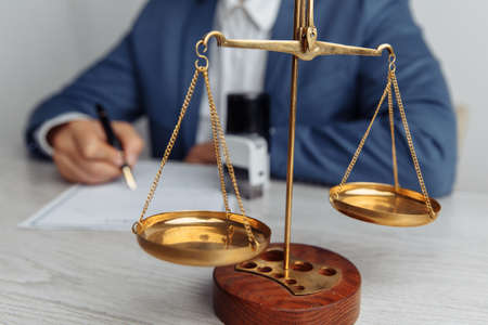Notary man signing document at office. Notary public toolsの写真素材