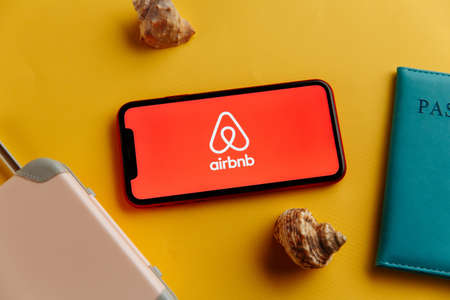Tula, Russia - October 18, 2020: Airbnb logo on iPhone display