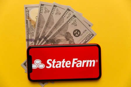 Tula, Russia - November 04, 2020: StateFarm logo on iPhone display