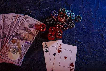 Game cards with chips and dices on a grey background. Poker onlineの写真素材