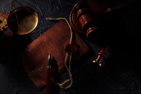 Notary tools. Law concept. Scales of justice, envelope and wooden judges gavelの写真素材