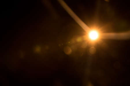 Abstract Natural Sun flare on the blackの写真素材