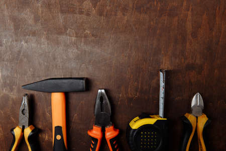 Set of different tools for repair on wood background. Top viewの写真素材