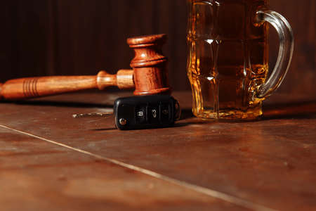 Drunk driving concept. Judge gavel, glass of beer and car keyの写真素材