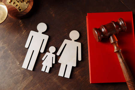 Judges gavel on book and family figuresの写真素材