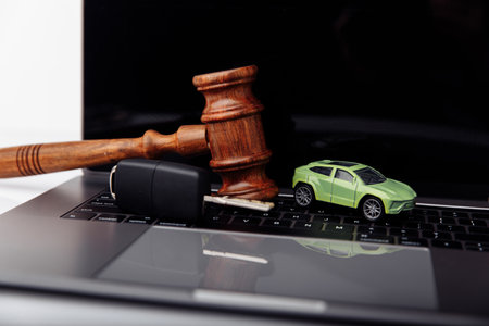 Wooden judge gavel with key and car. Auction and bidding conceptの写真素材