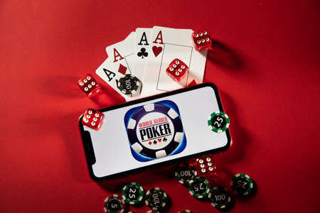 Tula, Russia - March 02, 2021: World Series of Poker logo on iPhone display