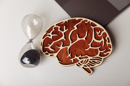 Wooden human brain and hourglassの写真素材