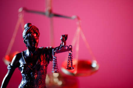 Figure of Lady Justice in notary office close-up. Symbol of justice and lawの写真素材