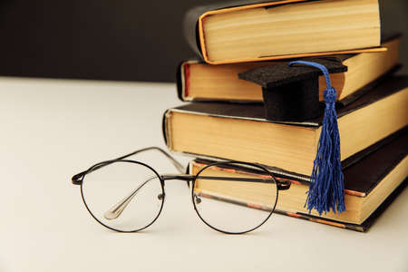 Graduation cap on a table. Graduation conceptの写真素材