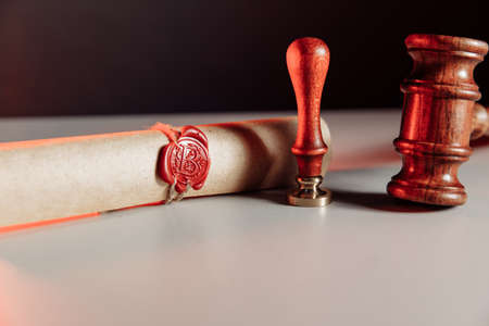 Scroll with wax seal stamp and gavelの写真素材