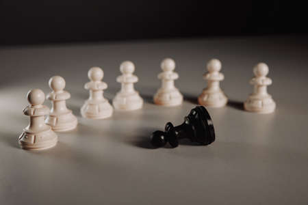 Leadership concept, pawn of chess standing out from the crowd of whiteの写真素材