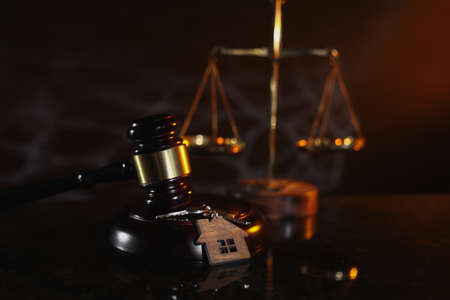 Law and Justice. Judge gavel and wedding rings close-upの写真素材