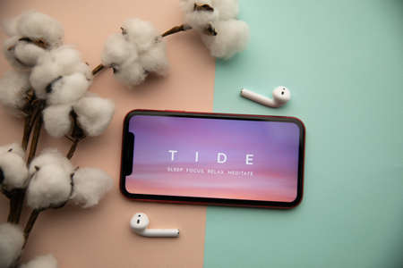 Tula, Russia - September 07, 2021: Tide app logo on iPhone displayのeditorial素材
