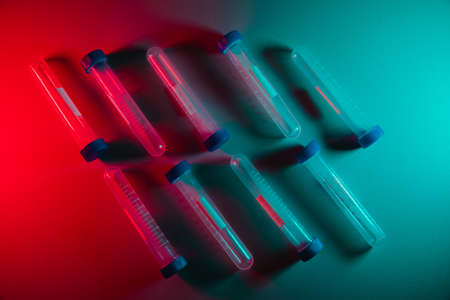 Test tubes on a table. Medicine and biological or chemical research, neon lightingの写真素材