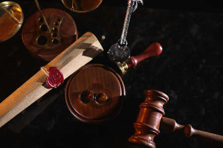 Last will and rings in notary office. Death and legacy concept. Top view.の写真素材