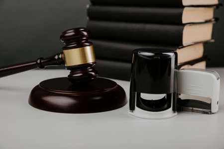 Judge gavel and notary stamp on a desktop close-upの写真素材